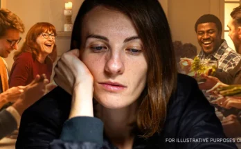 A woman looking sad while people laugh in the background | Source: Shutterstock