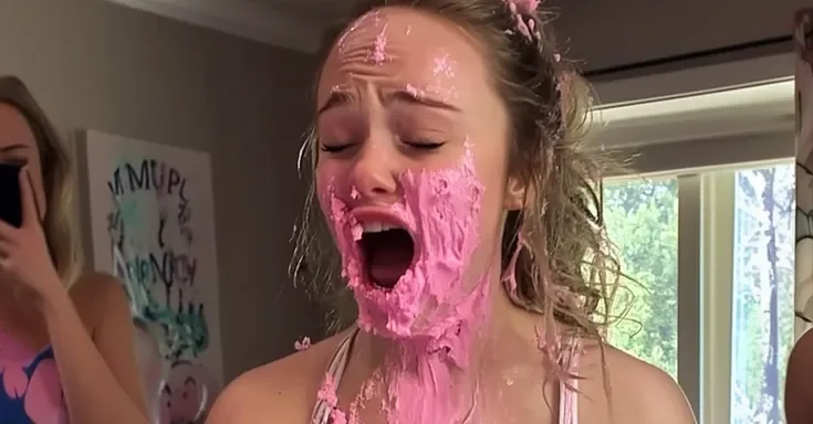 A woman with cake on her face | Source: Amomama