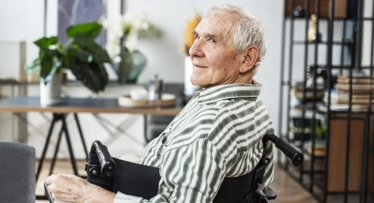 An older man sitting in a wheelchair | Souce: Freepik