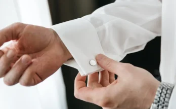 A groom adjusting his cufflink | Source: Shutterstock