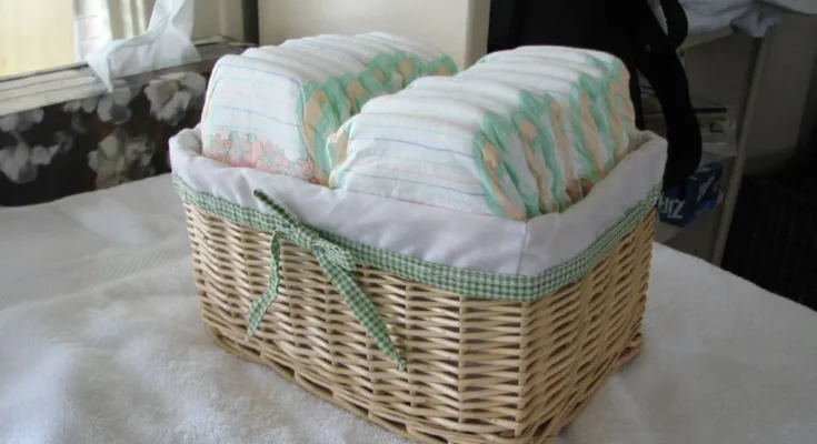 A wicker basket neatly filled with baby diapers | Source: Flickr/IngaMun/CC BY 2.0