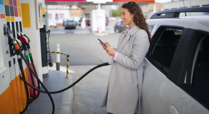 A woman at a gas station | Source: Freepik