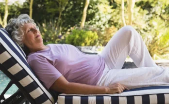 An older woman lounging at a poolside | Source: Shutterstock