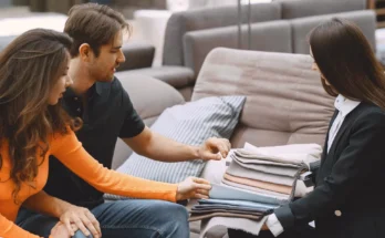 A couple checking out furniture swatches | Source: Freepik.com/prostooleh