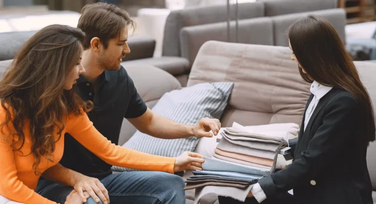 A couple checking out furniture swatches | Source: Freepik.com/prostooleh