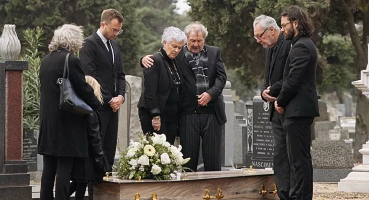 A family at a funeral | Source: Shutterstock