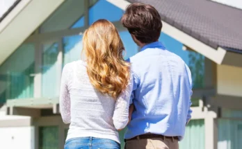 A couple staring at their dream home | Source: Shutterstock