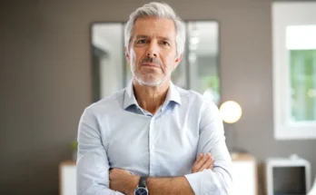 A man standing with his arms crossed | Source: Shutterstock