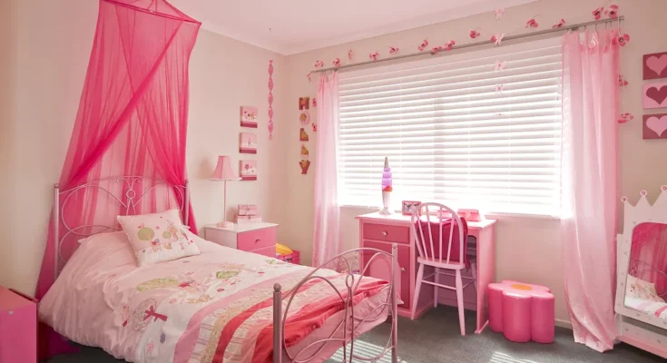 Bright pink-themed girl's bedroom with whimsical decor and cozy charm | Source: Shutterstock