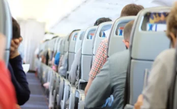 Passengers seated in economy class during a commercial flight | Source: Shutterstock
