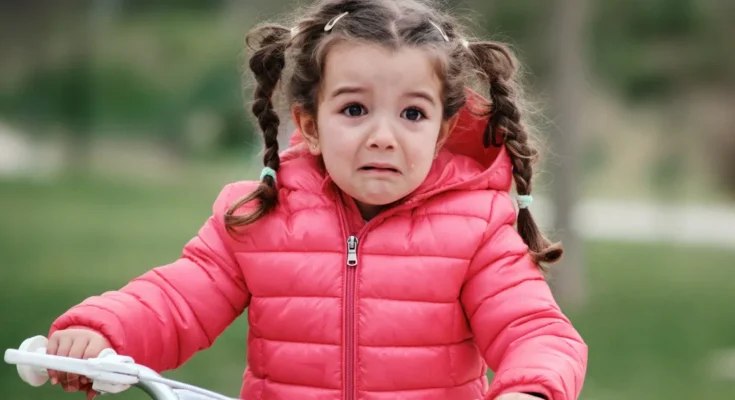Scared girl on a bicycle | Source: Getty Images