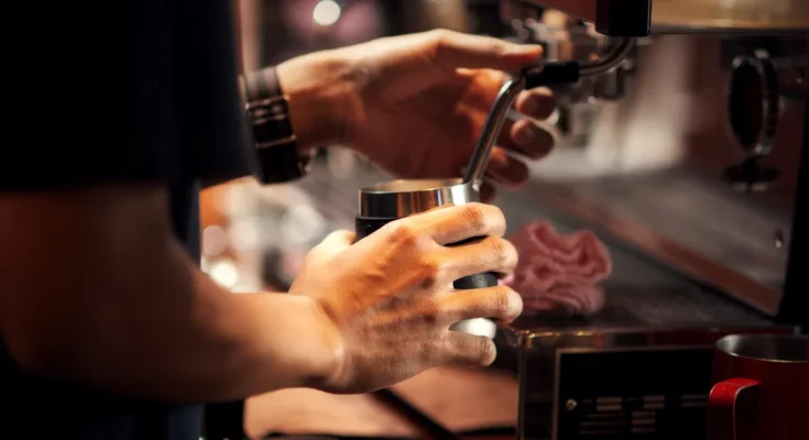 Barista preparing coffee | Source: Shutterstock