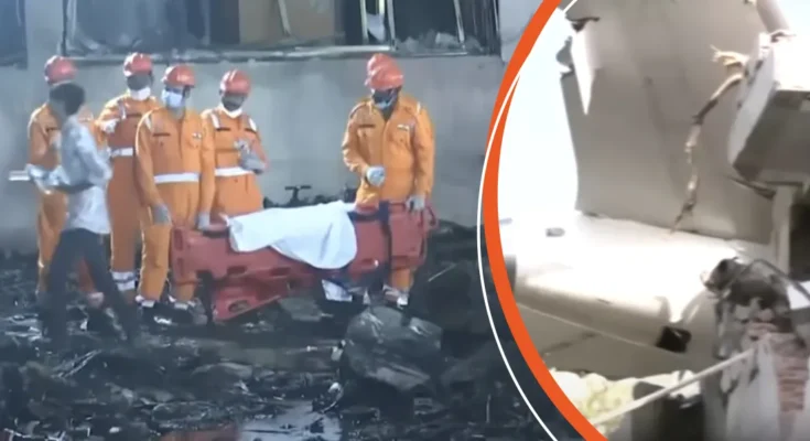 Rescue workers recover bodies from the crash site | Part of the aircraft embedded in the building exterior | Source: YouTube/ABCNews