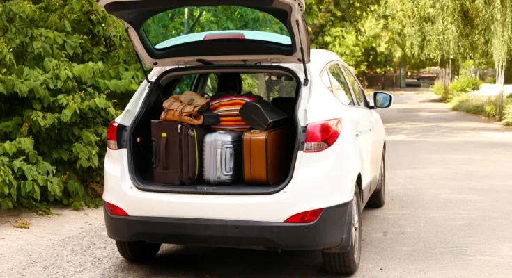 Suitcases packed into a car trunk | Source: Shutterstock