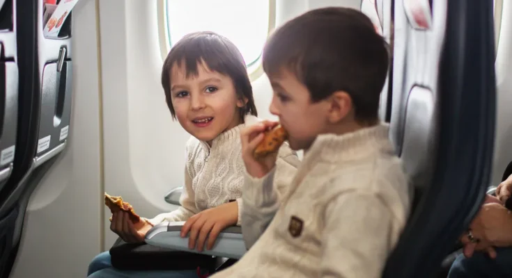 Children on a plane | Source: Shutterstock