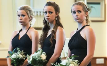 Three bridesmaids wearing black | Source: AmoMama