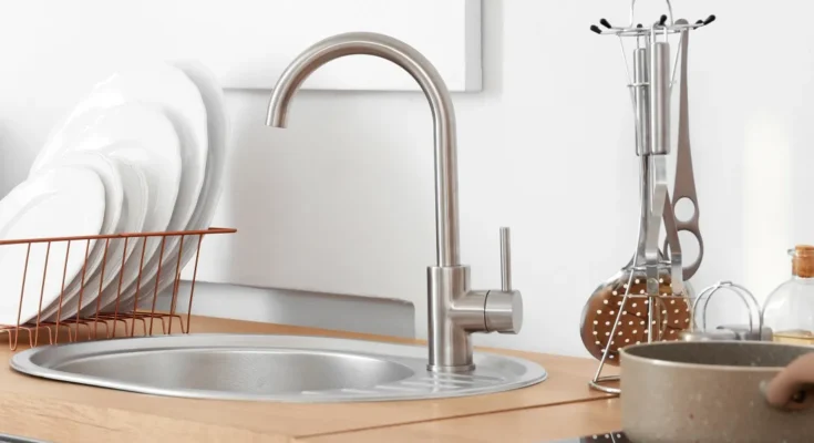 Utensils next to the kitchen sink | Source: Shutterstock