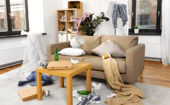 A messy living room with takeout boxes, clothes, and trash scattered around | Source: Shutterstock