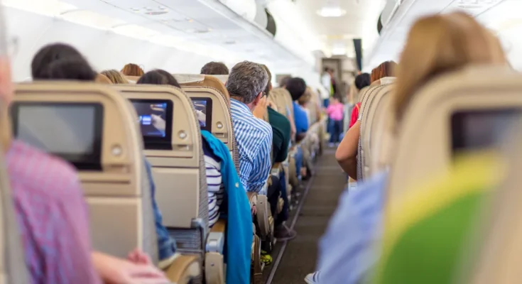 People sitting on a flight | Source: Shutterstock