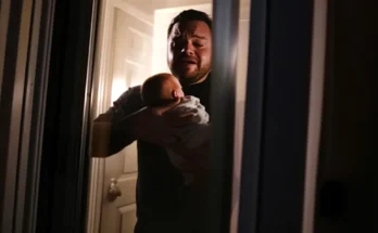 An upset man holding a baby | Source: The Celebritist