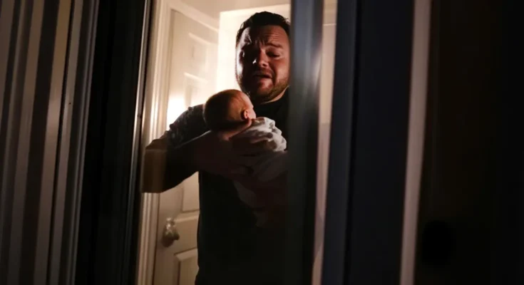 An upset man holding a baby | Source: The Celebritist