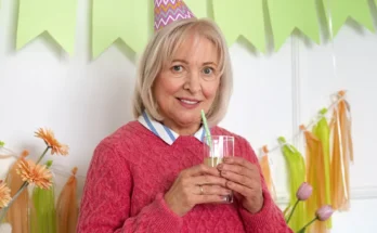 A woman attending a birthday celebration | Source: Freepik