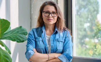 A woman standing with folded arms | Source: Shutterstock