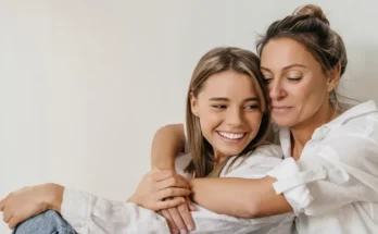 A woman hugging her teen daughter | Source: Shutterstock