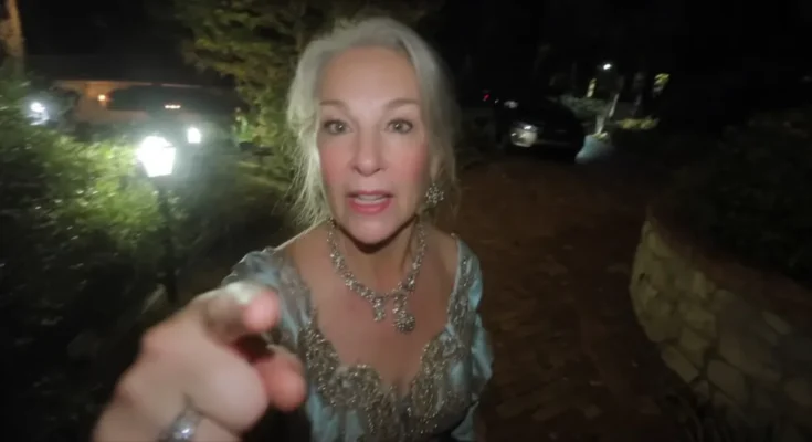 Angry elderly woman pointing at someone in front of her | Source: Midjourney