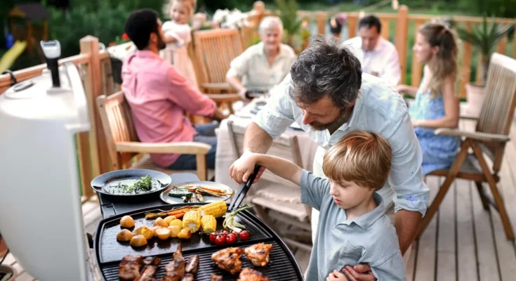 A family at a barbecue | Source: Shutterstock