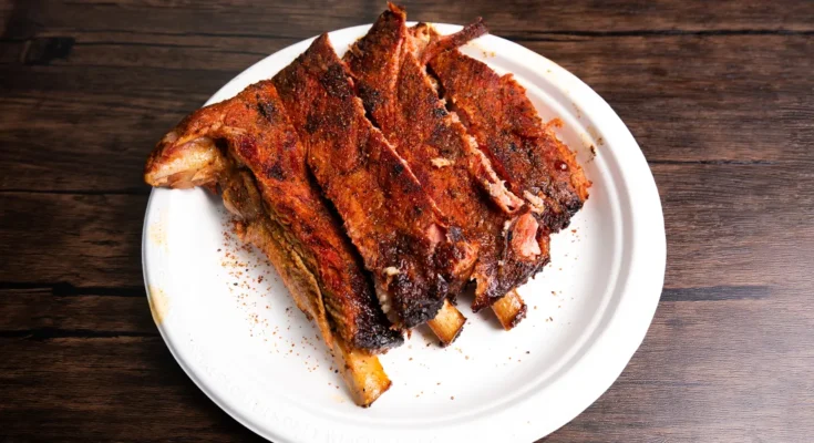 Barbecued ribs on a plate | Source: Shutterstock